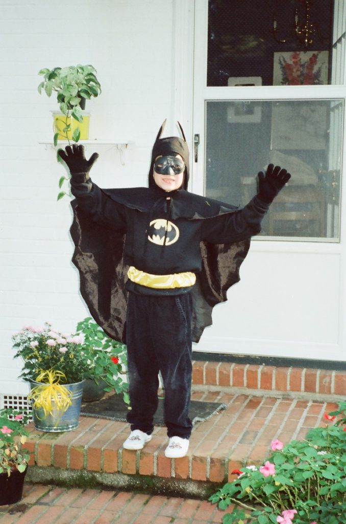 child in a batman costume