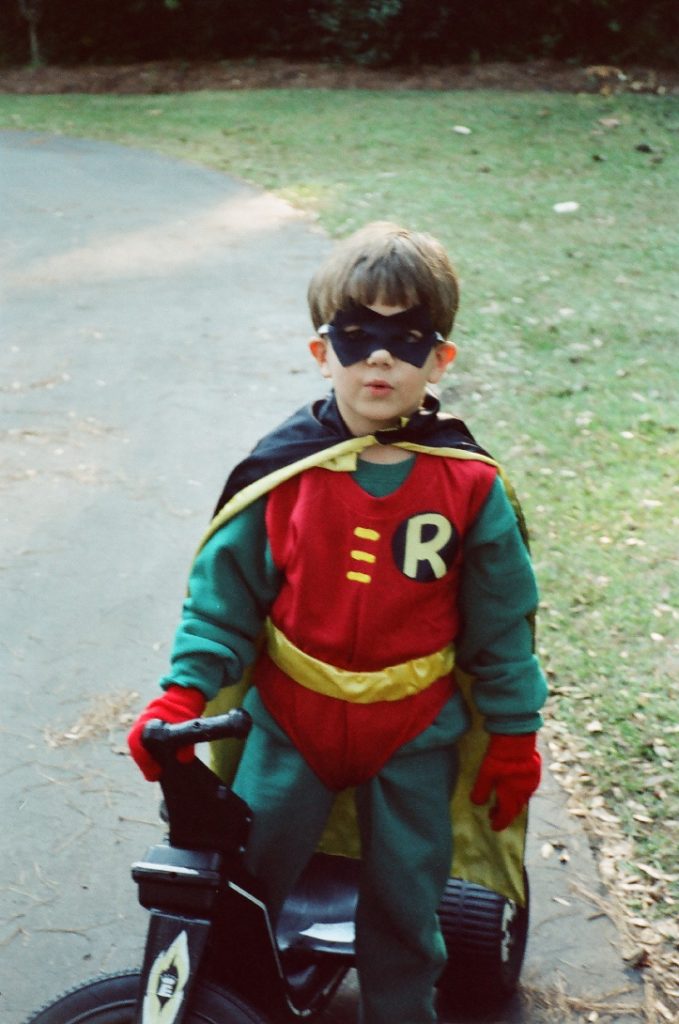 little boy in a Robin costume