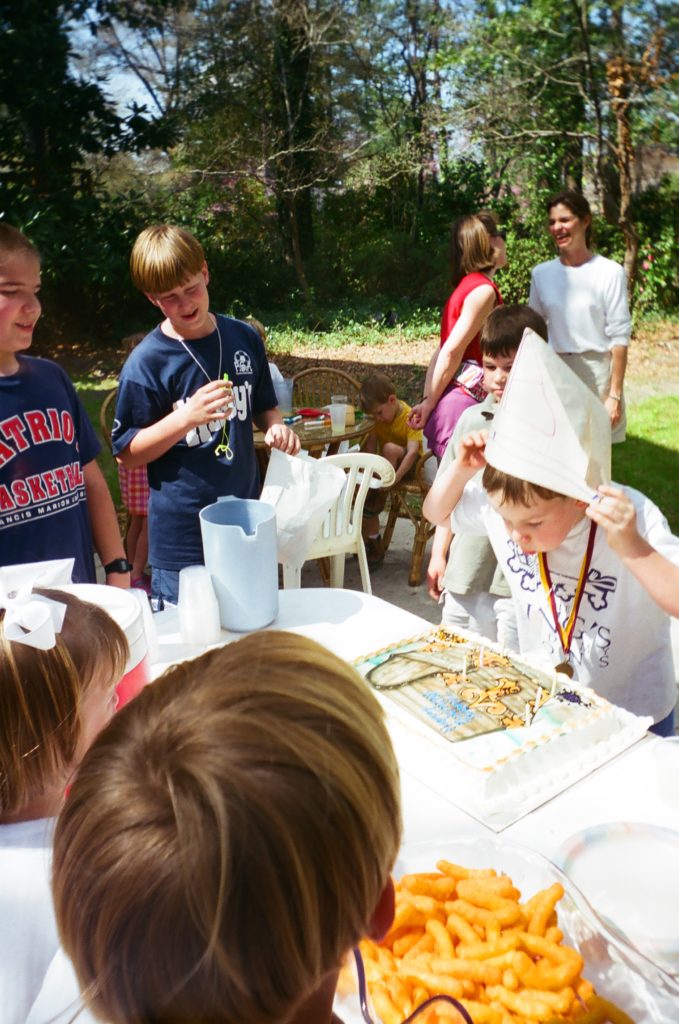 Boy blowing out birthday candles