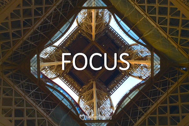 "Focus" over a stained glass window