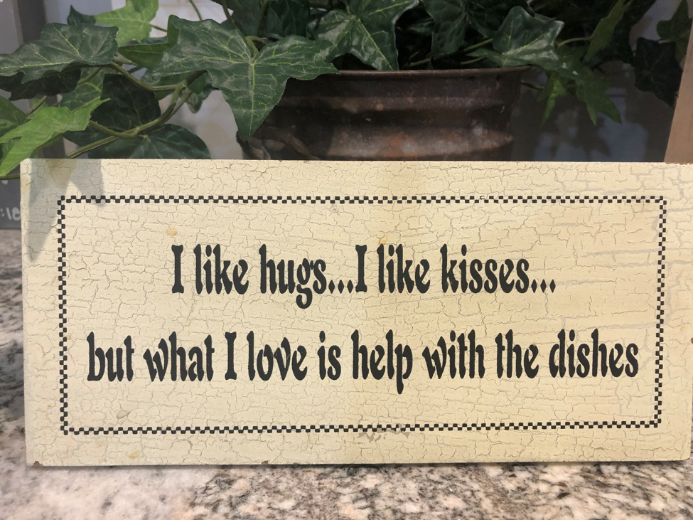 I like hugs I like kisses but what I love is help with the dishes